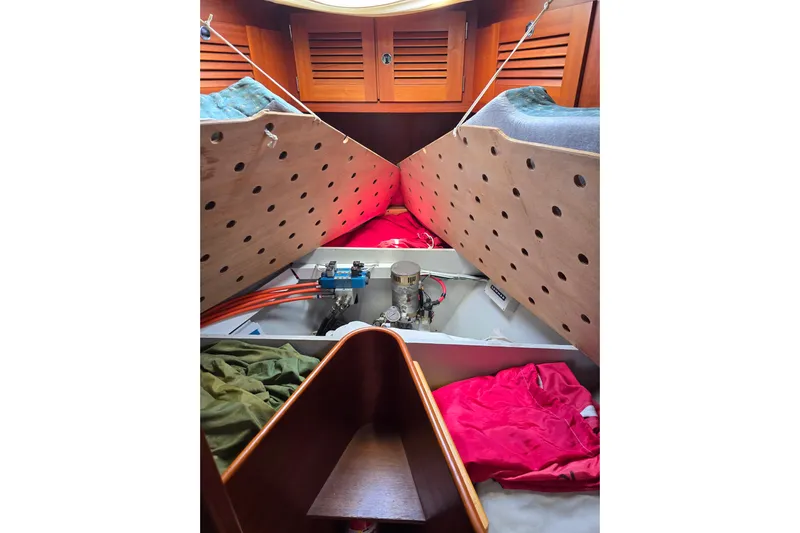 Georgia B Yacht Photos Pics Interior view of 2000 Hallberg-Rassy 42F Mk II sailboat cabin with storage compartments.