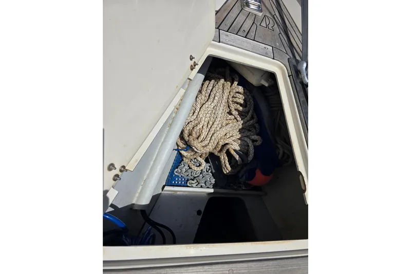 Georgia B Yacht Photos Pics Storage compartment on 2000 Hallberg-Rassy 42F Mk II sailboat with rope and chain.
