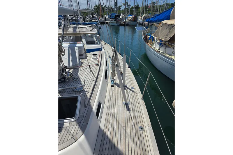 Georgia B Yacht Photos Pics 2000 Hallberg-Rassy 42F Mk II sailboat docked in marina, showcasing teak deck and rigging.