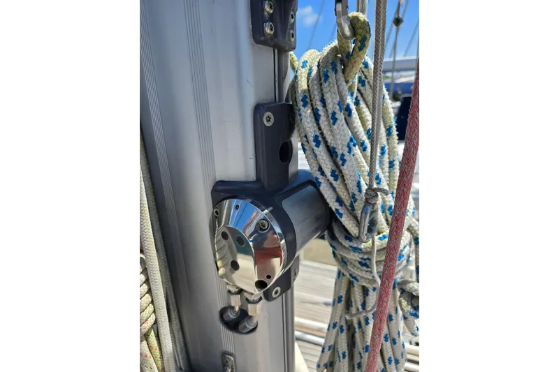 Georgia B Yacht Photos Pics Close-up of Hallberg-Rassy 42F Mk II sailboat rigging, featuring ropes and metal fittings.