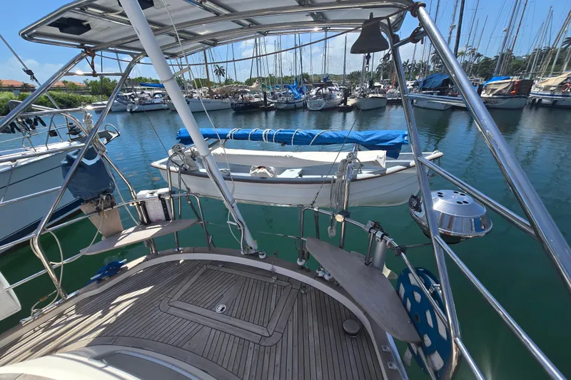 Georgia B Yacht Photos Pics Hallberg-Rassy 42F Mk II yacht, 2000 model, docked in a marina with clear blue water.