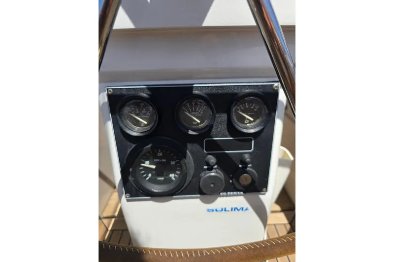 Georgia B Yacht Photos Pics Control panel of a 2000 Hallberg-Rassy 42F Mk II yacht, featuring gauges and dials.