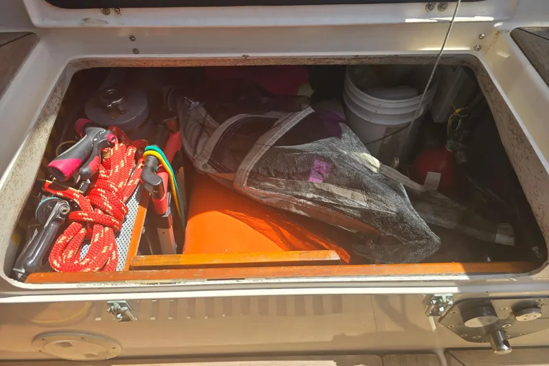 Georgia B Yacht Photos Pics Storage compartment on a 2000 Hallberg-Rassy 42F Mk II yacht with sailing gear.