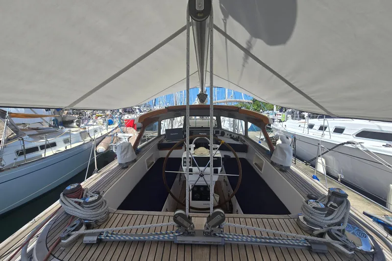 Georgia B Yacht Photos Pics Hallberg-Rassy 42F Mk II yacht cockpit, 2000 model, with canopy and marina view.