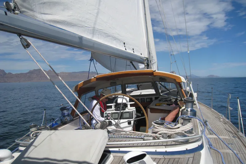 Georgia B Yacht Photos Pics Sailing on a 2000 Hallberg-Rassy 42F Mk II yacht in open waters.