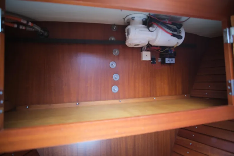 Georgia B Yacht Photos Pics Wooden interior compartment of 2000 Hallberg-Rassy 42F Mk II yacht, featuring electrical components.