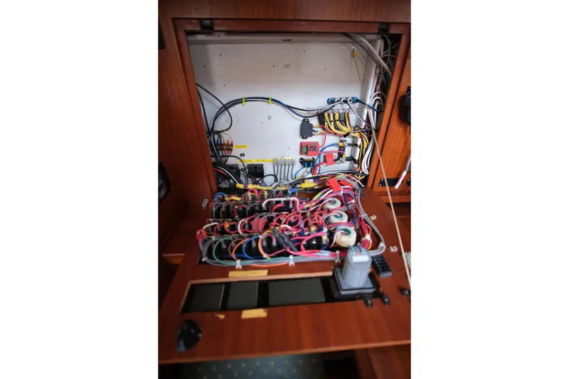 Georgia B Yacht Photos Pics Electrical panel of 2000 Hallberg-Rassy 42F Mk II sailboat, showcasing wiring and components.
