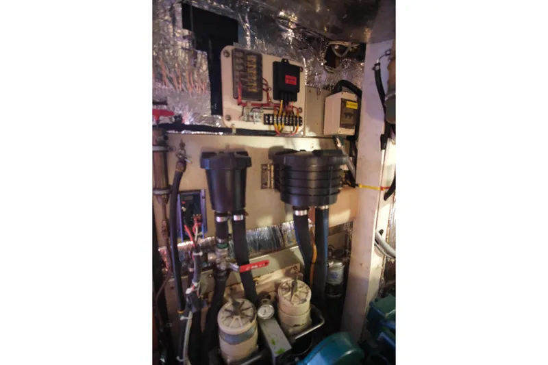 Georgia B Yacht Photos Pics Engine room of 2000 Hallberg-Rassy 42F Mk II yacht, showing mechanical components and wiring.