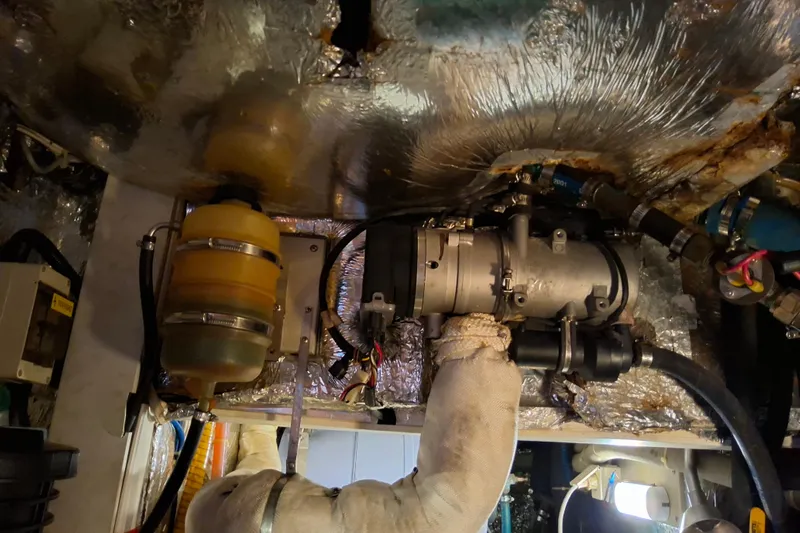 Georgia B Yacht Photos Pics Engine room of a 2000 Hallberg-Rassy 42F Mk II sailboat, showing mechanical components.