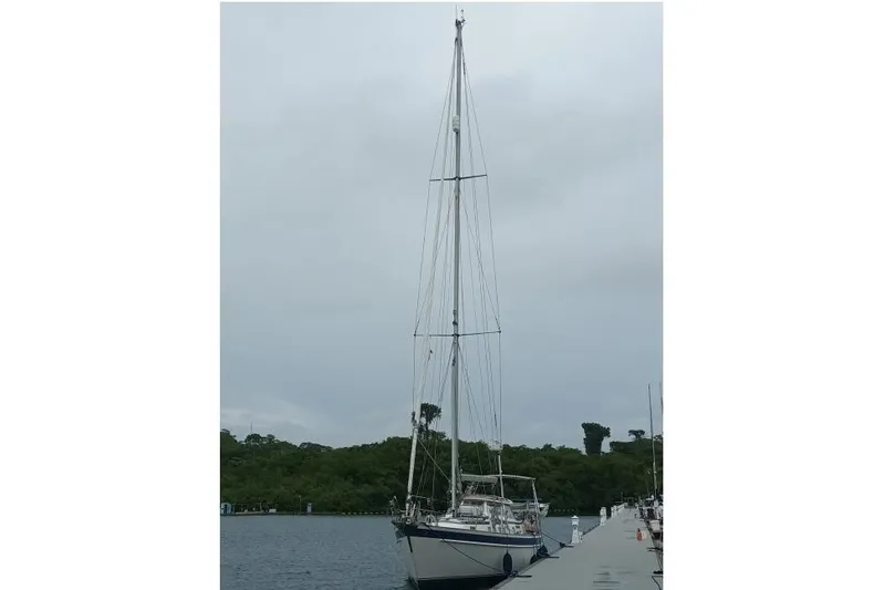Georgia B Yacht Photos Pics 2000 Hallberg-Rassy 42F Mk II sailboat docked on a cloudy day.