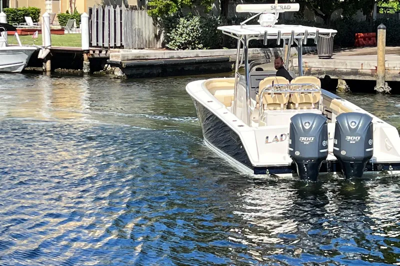 Lady Michelle Yacht Photos Pics 2012 Jupiter 29 FS CC boat with dual engines cruising on a sunny waterway.