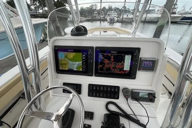 Lady Michelle Yacht Photos Pics 2012 Jupiter 29 FS CC boat dashboard with navigation screens and controls at marina.