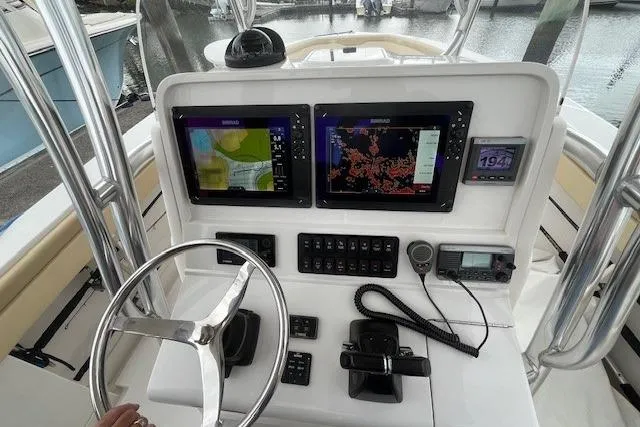 Lady Michelle Yacht Photos Pics 2012 Jupiter 29 FS CC boat dashboard with navigation screens and controls.