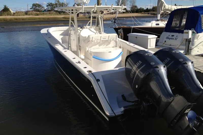 Lady Michelle Yacht Photos Pics 2012 Jupiter 29 FS CC boat with twin Yamaha engines docked in calm waters.