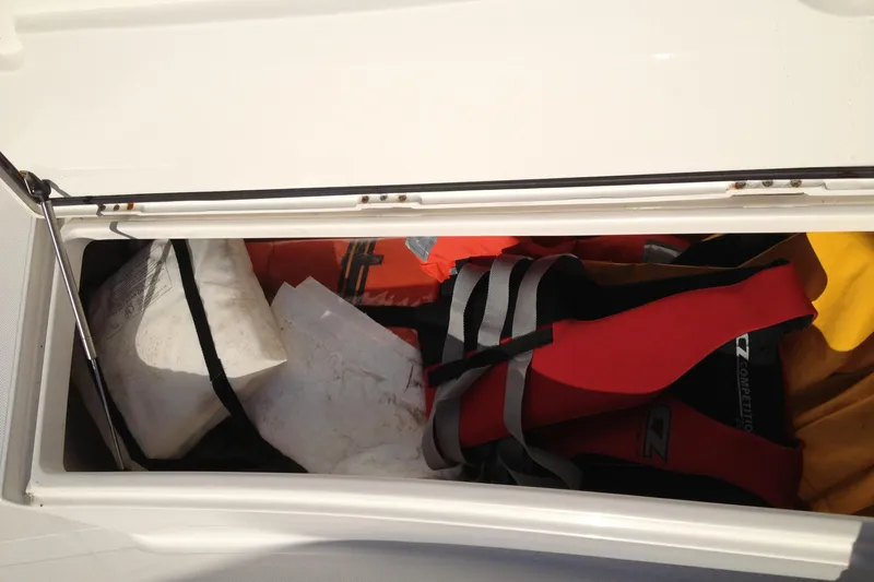 Lady Michelle Yacht Photos Pics Storage compartment of 2012 Jupiter 29 FS CC boat with life jackets and gear.