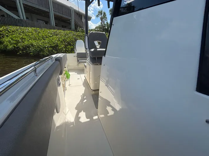  Yacht Photos Pics 2023 Stingray 273 CC boat interior with seating and sleek design.