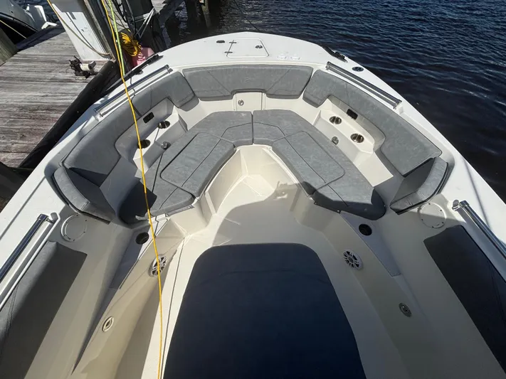  Yacht Photos Pics 2023 Stingray 273 CC boat interior with spacious seating and modern design.