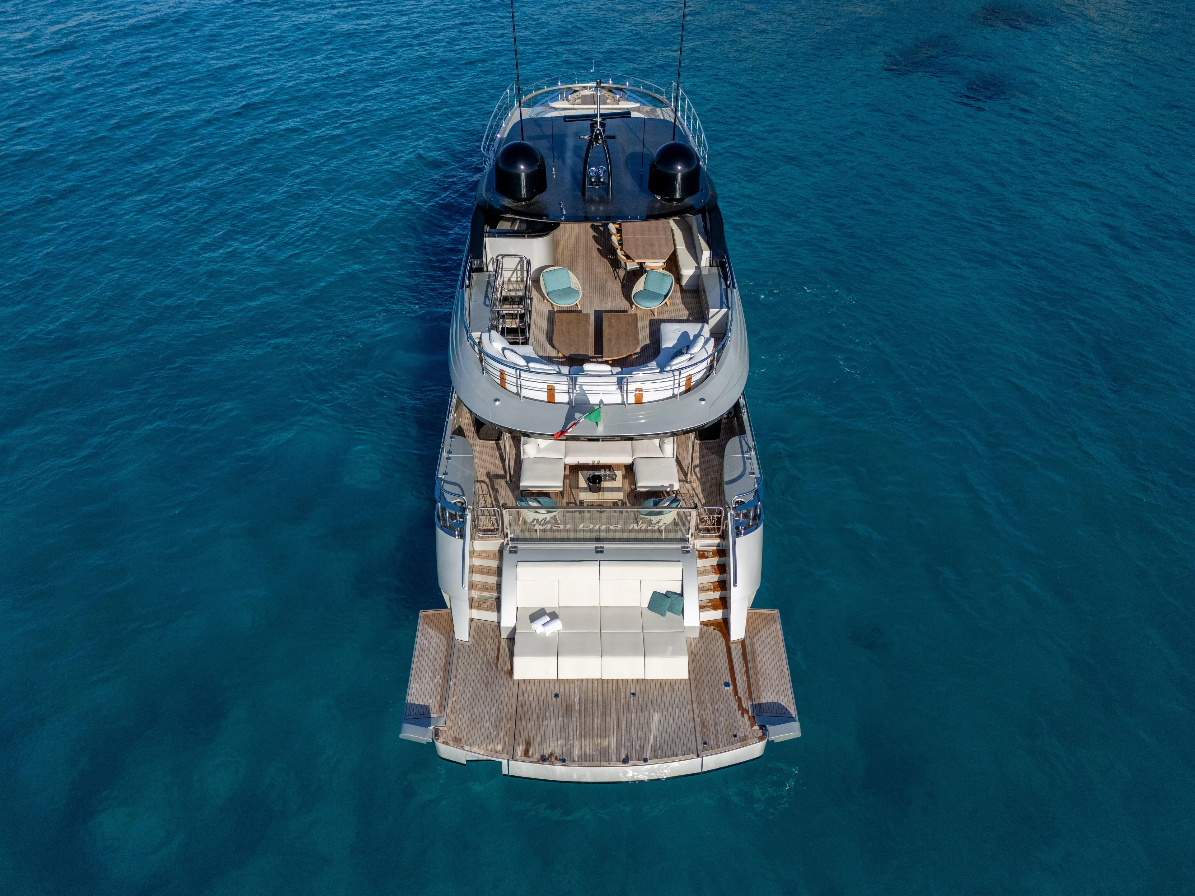  Yacht Photos Pics 2024 Filippetti F100 yacht on clear blue water, aerial view.