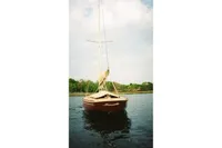 Sailboat Latitude 46 Tofinou 7, 2007 model, anchored on calm water.