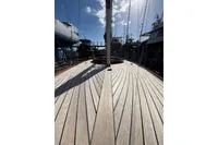 Deck view of 2007 Latitude 46 Tofinou 7 sailboat in a marina.