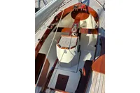 2007 Latitude 46 Tofinou 7 sailboat interior with wooden and white finishes.