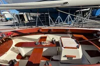 2007 Latitude 46 Tofinou 7 sailboat interior with wooden finish, docked in a marina.