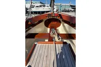 2007 Latitude 46 Tofinou 7 sailboat interior with wooden deck and ropes.