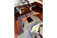 2007 Latitude 46 Tofinou 7 sailboat cockpit with polished wood finish.