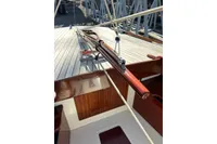 2007 Latitude 46 Tofinou 7 sailboat deck with polished wood and rigging details.