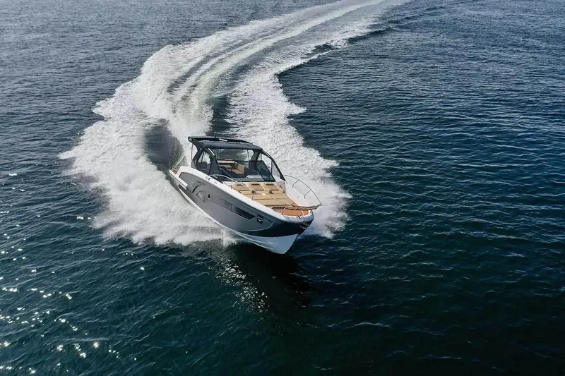 Custom Order Your 387 Today! Yacht Photos Pics 2025 Hanover 387 Inboard boat cruising on open water, creating a dynamic wake.