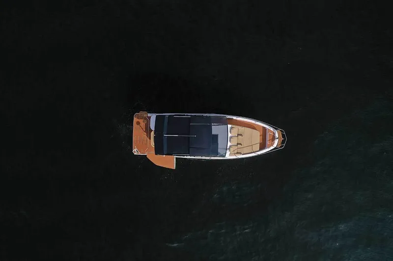 Custom Order Your 387 Today! Yacht Photos Pics Aerial view of 2025 Hanover 387 Inboard boat on dark water.