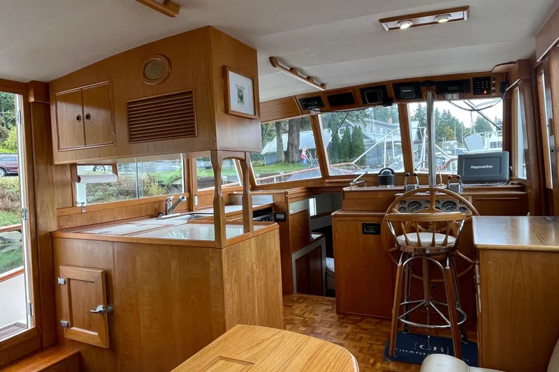 Mercator Yacht Photos Pics Interior of 1985 Grand Banks 42 Classic yacht with wooden cabinetry and navigation equipment.