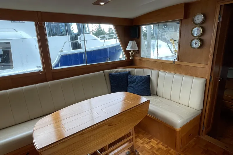 Mercator Yacht Photos Pics Interior of 1985 Grand Banks 42 Classic yacht with wood and leather seating.