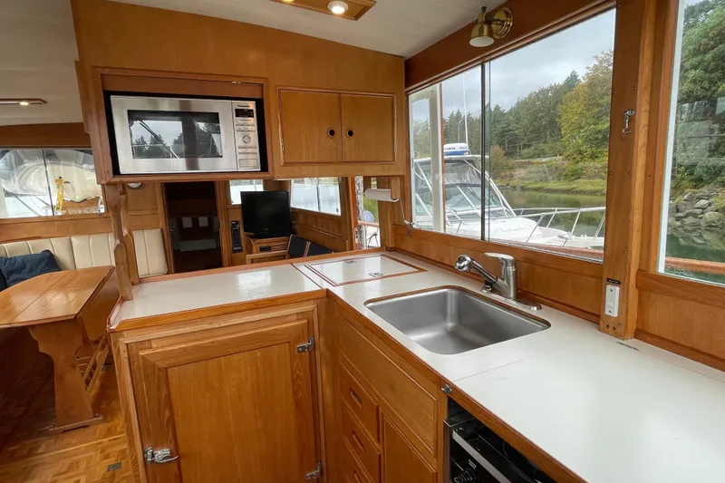 Mercator Yacht Photos Pics Interior of 1985 Grand Banks 42 Classic yacht with wooden cabinetry and modern amenities.