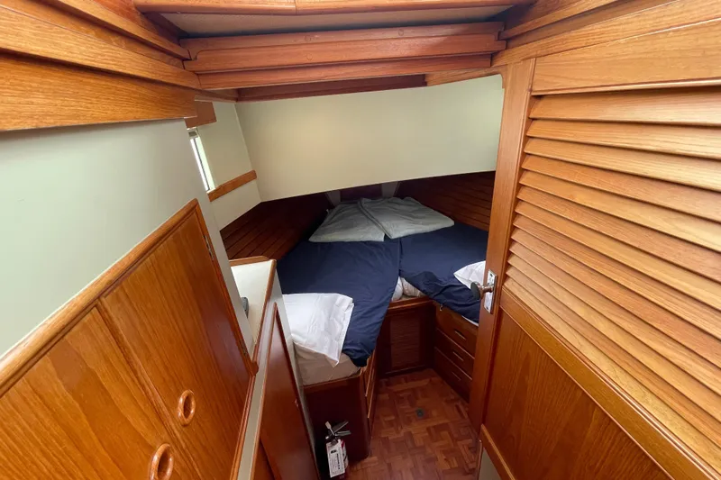 Mercator Yacht Photos Pics Cozy cabin interior of 1985 Grand Banks 42 Classic yacht with wooden finishes.