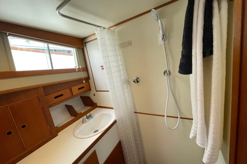Mercator Yacht Photos Pics Bathroom interior of 1985 Grand Banks 42 Classic yacht, featuring shower and sink.