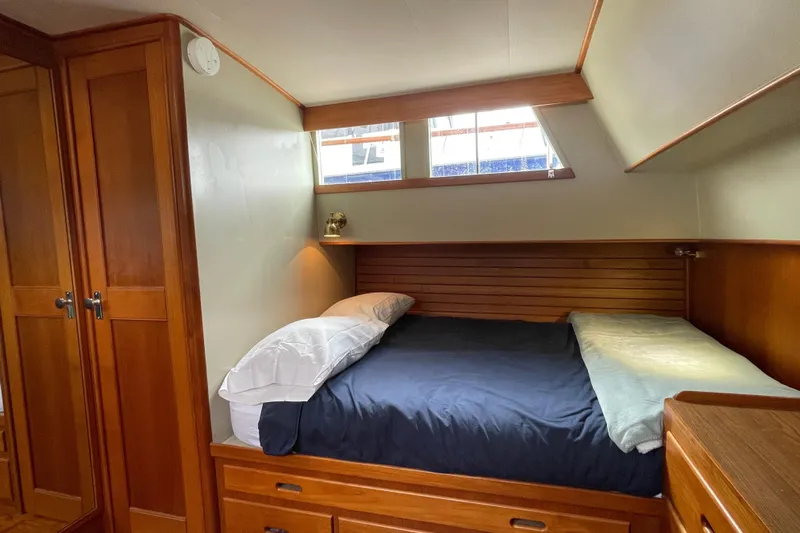 Mercator Yacht Photos Pics Cozy cabin interior of 1985 Grand Banks 42 Classic yacht with wooden furnishings.