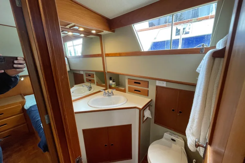 Mercator Yacht Photos Pics Bathroom interior of 1985 Grand Banks 42 Classic yacht, featuring sink and toilet.