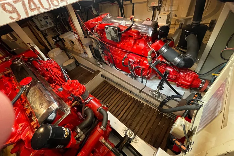 Mercator Yacht Photos Pics Engine room of a 1985 Grand Banks 42 Classic with vibrant red machinery.