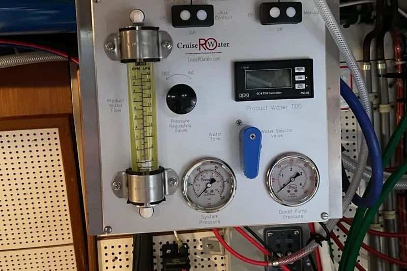 Mercator Yacht Photos Pics Control panel of a 1985 Grand Banks 42 Classic, featuring water flow and pressure gauges.