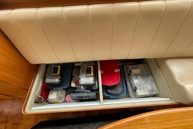 Mercator Yacht Photos Pics Under-seat storage on 1985 Grand Banks 42 Classic, filled with organized containers.