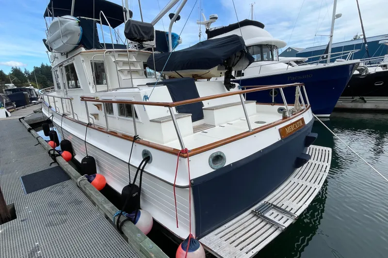 Mercator Yacht Photos Pics 1985 Grand Banks 42 Classic yacht docked at marina, rear view.