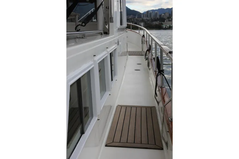 Mercator Yacht Photos Pics 1985 Grand Banks 42 Classic yacht deck with scenic waterfront view.