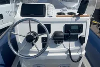 2022 Gemini WR650 boat dashboard with steering wheel, navigation equipment, and communication devices.