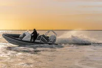 2022 Gemini WR650 boat cruising at sunset on open water.