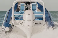 2022 Gemini WR650 boat cruising on open water, rear view with powerful engine.