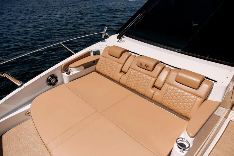 Lady Iryna Yacht Photos Pics Luxurious seating on 2022 Sea Ray Sundancer 320 Outboard, featuring tan leather upholstery.