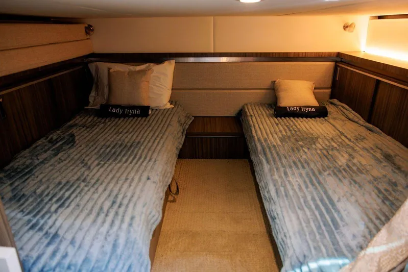 Lady Iryna Yacht Photos Pics 2022 Sea Ray Sundancer 320 Outboard cabin with twin beds and cozy decor.