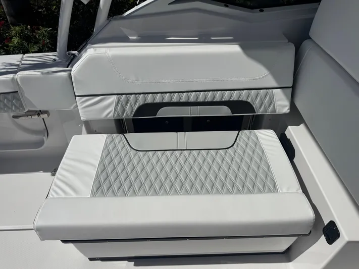  Yacht Photos Pics 2026 Blackfin 272 DC boat seat with diamond-patterned upholstery.