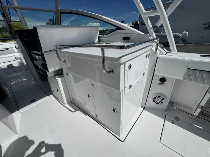  Yacht Photos Pics 2026 Blackfin 272 DC boat interior with sleek white cabinetry and seating.